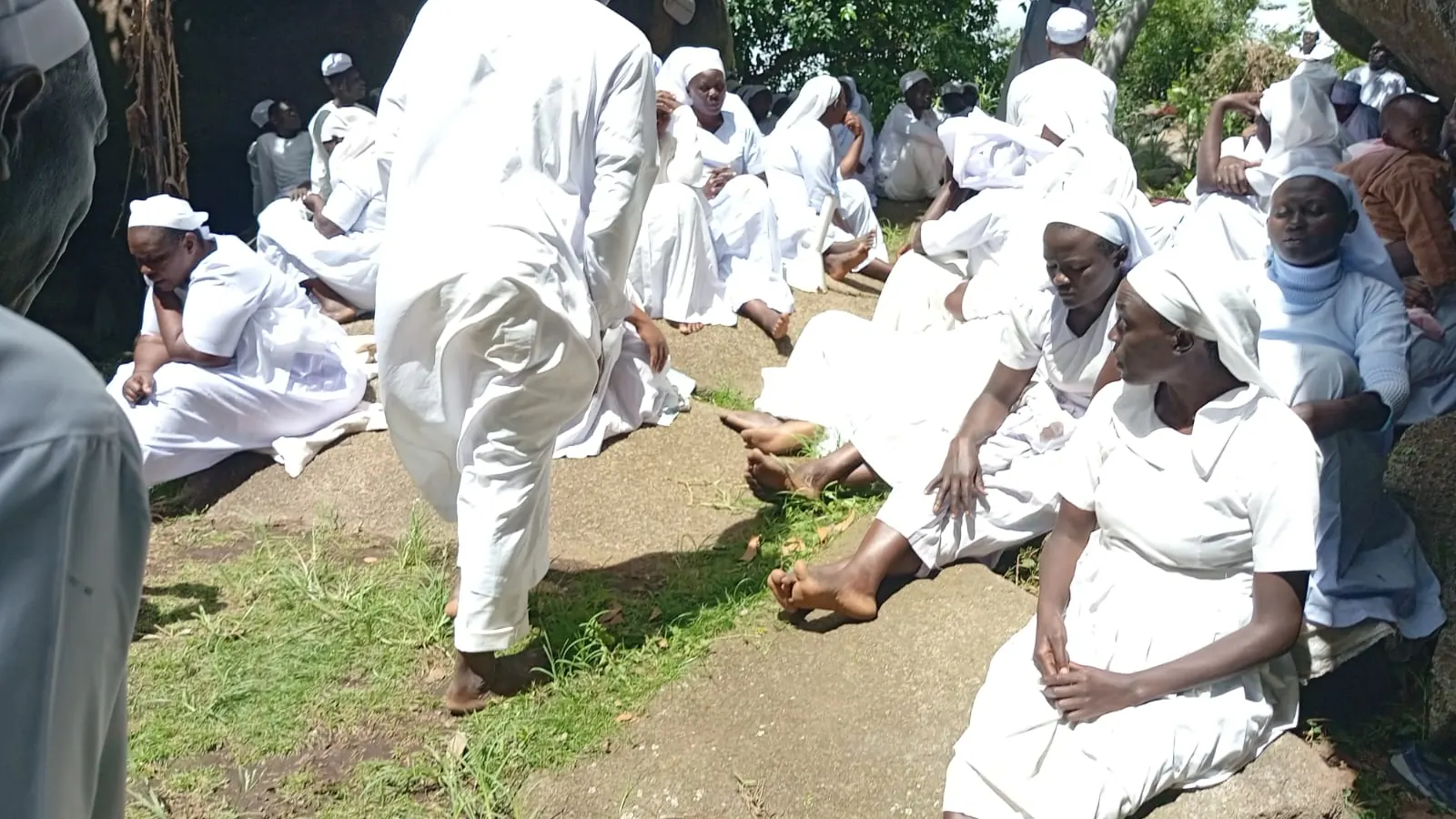 Women and church members gathered outdoors for fellowship